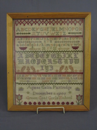 An Edwardian needlework sampler with alphabet and numerals by Agnes Celia Partridge December 2 1908 of Greencoat Girls School 12" x 10" (some small holes to base)