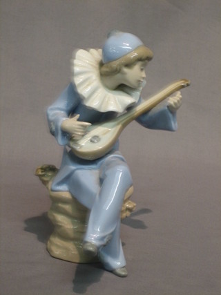 A Nao figure of a seated minstrel with mandolin (mandolin loose, fingers chipped) 7"