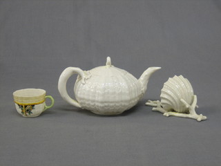 A circular Beleek teapot with green mark to the base, a Beleek shell shaped stoop with black mark to the base together with a small Beleek cup