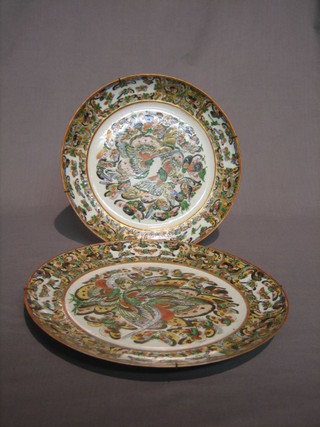 A pair of Chinese famille vert porcelain plates decorated butterflies amidst branches