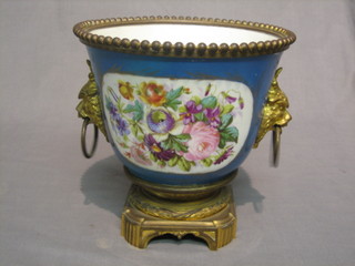 A 19th Century Sevres style porcelain jardiniere, with floral panels and gilt ormolu mounts and lion ring mask handles, raised on a circular base 9"