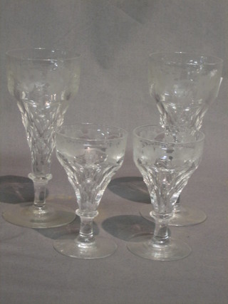 A suite of 21 etched wine glasses with vinery decoration comprising 7 champagne flutes and 14 various liqueur glasses