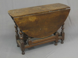 An 18th Century oak oval drop flap gateleg dining table, fitted 2 frieze drawers, raised on turned supports 42"