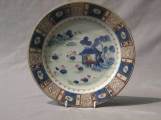 A circular Japanese Imari porcelain plate with panelled decoration 9"