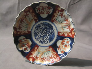 A 19th Century Japanese Imari porcelain plate with lobed and panelled decoration 8"