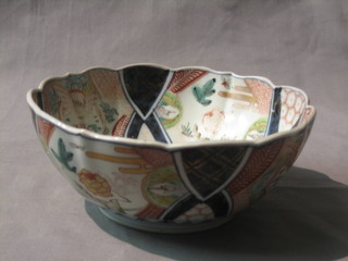 A 19th Century circular Japanese Imari porcelain bowl with lobed decoration 8" (some fading)