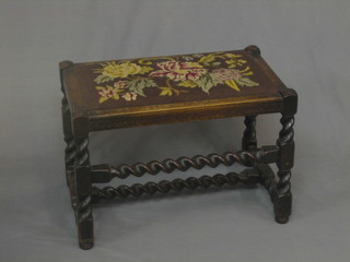 A 1930's rectangular oak stool with barley twist turned and block supports 24"