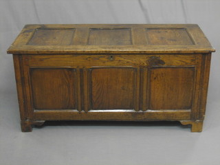 An 18th Century elm coffer of plank construction with hinged lid, 48"