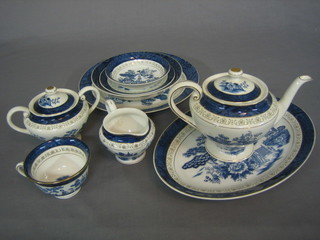 A blue and white Willow pattern tea/dinner service