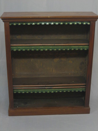 A Victorian mahogany bookcase fitted adjustable shelves, raised on a platform bae 36"