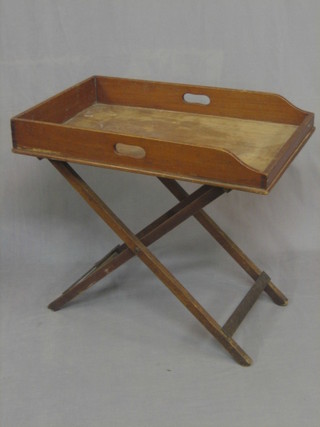 A Victorian mahogany butler's tray complete with folding stand