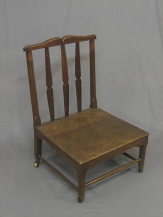 An unusual stick and rail back "nursing" chair
