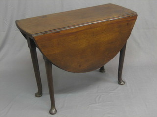 A Georgian mahogany oval drop flap gateleg dining table, raised on club supports 38"