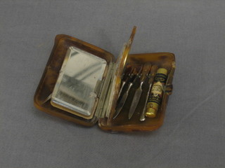 A lady's 1930's rectangular tortoiseshell necessaire fitted 2 rouge pots, manicure implements etc, 3"