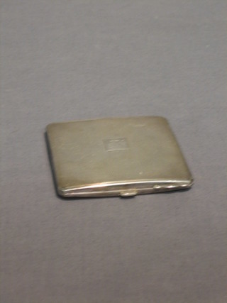 An Art Deco silver compact with engine turned decoration Birmingham 1941