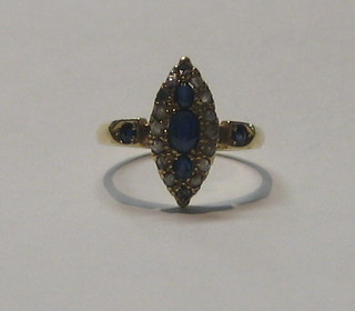 A lady's 18ct gold marquise shaped dress ring set sapphires and diamonds