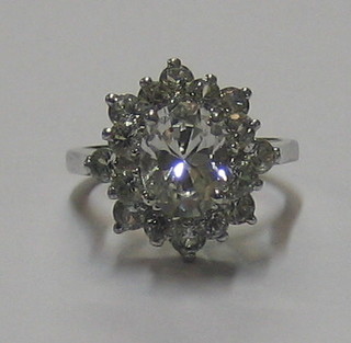 A cluster dress ring set brilliant cut stones