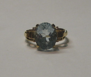 A lady's 18ct gold dress ring set an oval cut aquamarine