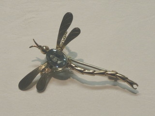 A lady's 9ct gold bar brooch in the form of a dragon fly, the body set aquamarine