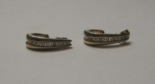 A pair of lady's gold hoop earrings, each set 5 diamonds
