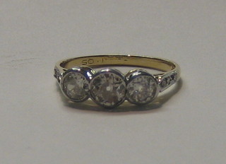 A lady's 18ct gold engagement/dress ring set 3 large diamonds and 6 small diamonds to the shoulders (approx 1.05ct)