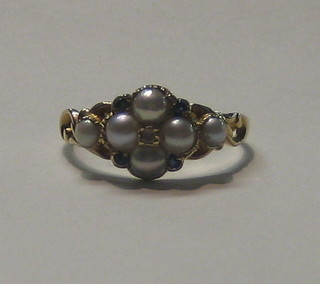 A lady's 18ct gold dress ring set 6 demi-pearls, 4 sapphires and a small diamond