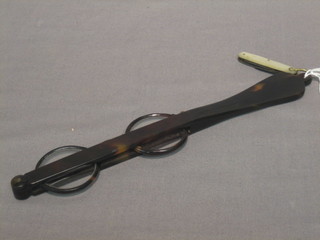 A pair of "tortoiseshell" cased lorgnettes and a small folding pen knife with mother of pearl grips