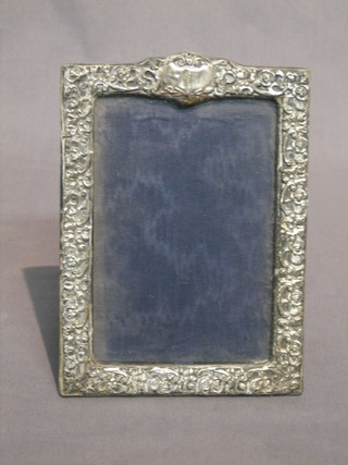 An Edwardian embossed silver easel photograph frame, Birmingham 1904 7" x 5"