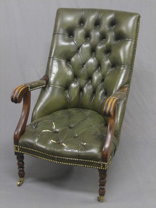 A Georgian style mahogany open arm tub back chair  upholstered in green buttoned material