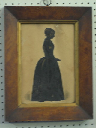 20th Century silhouette of a standing lady 9" x 7" contained in  a walnut frame
