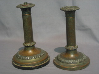 A  pair  of  19th Century Sheffield  plate  candlesticks  with  rope edge borders 8"