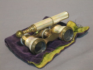 A  pair  of 19th Century mother of pearl opera glasses  (f),  cased