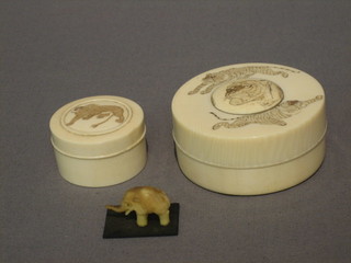 A miniature carved ivory figure of an elephant, a circular  carved ivory  trinket  box decorated tigers 2 1/2" and 1 other  small  box decorated a lion 2" 