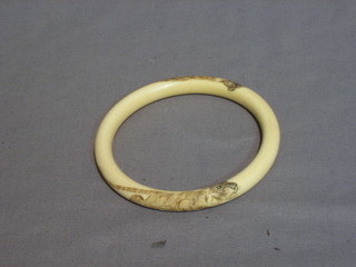 An ivory bangle carved a lion