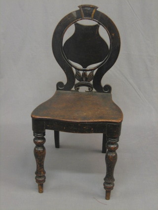 A  19th Century mahogany shield back hall chair with  solid  seat