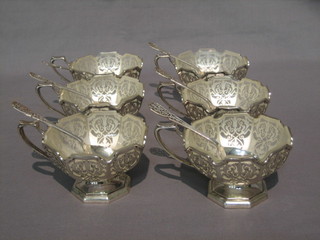 A set of 6 pierced silver ice cream cups with glass liners  together with   6  matching  spoons,  Sheffield  1959  and  1960,  35   ozs