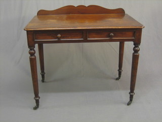 A  Victorian  mahogany  side  table fitted  2  drawers,  raised  on turned supports 38"