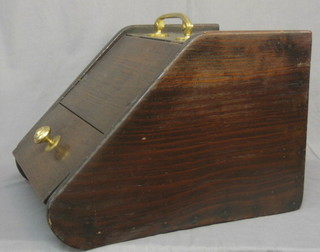An Edwardian stained pine coal box with hinged lid
