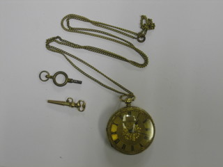 A  lady's  18ct  gold open faced fob watch hung  on  a  gilt  chain