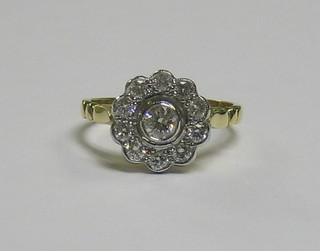 A  lady's  18ct gold cluster ring set numerous  diamonds  (approx 0.65ct)