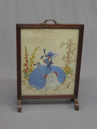 A  1930's  wool  work  fire  screen  depicting  a  Crinoline  lady, contained in a mahogany frame 17"