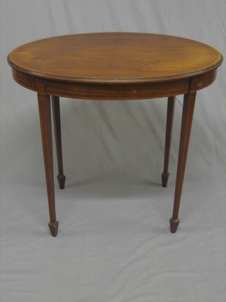 An  Edwardian oval inlaid mahogany occasional table,  raised  on square tapering supports ending in spade feet 30"