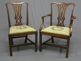 A  19th Century Chippendale style carver chair with  upholstered drop in seat, raised on square supports with box framed  stretcher together with a matching standard chair 