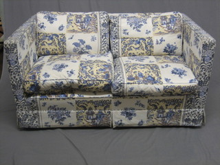 A  2  seat settee upholstered in Oriental  style  patterned  material 56"
