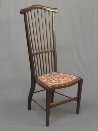 An  Edwardian mahogany Voisey style stick and rail back  dining chair (old break and repair to the back)