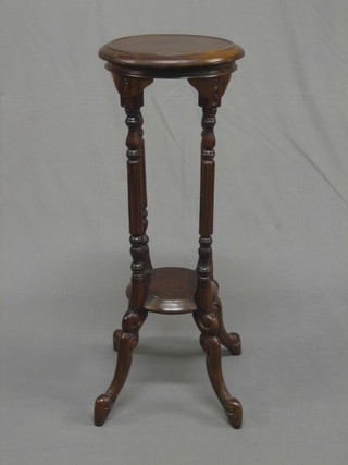 A  reproduction  Victorian style 2 tier jardiniere stand  raised  on turned and reeded supports 11"