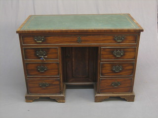 A  19th  Century  mahogany pedestal  kneehole  desk  with  inset tooled   writing  surface,  fitted  1  long  drawer  above   6   short  drawers, the pedestal fitted a cupboard and raised on bracket  feet 42"