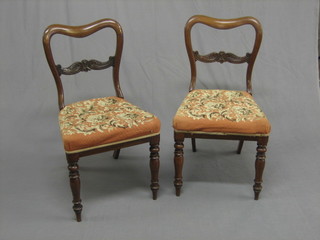A  set  of  6 Victorian rosewood spoon  back  dining  chairs  with carved  mid  rails  and  upholstered seats (1  with  back  f  and  r)