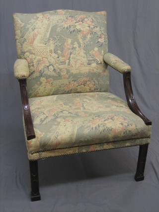 A   handsome  18th  Century  Chippendale  style  open   arm library  chair  raised  on square  tapering  supports 