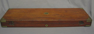 A  mahogany and brass banded gun case, the interior  with  paper label for Frederick Barnes & Co 32"